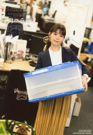 Uesaka Sumire dressed in a white top with a dark blue jacket and yellow skirt, pouting and carrying a large plastic box with both hands