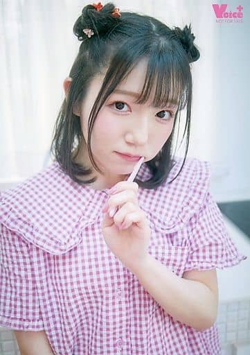 Kanno Mai in pink pajamas, with a white toothbrush in her mouth, showing a pouting face